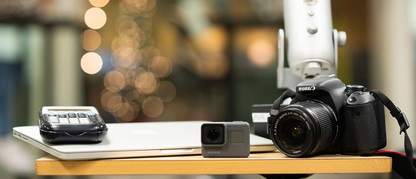 Canon camera and other electronic equipment on a table